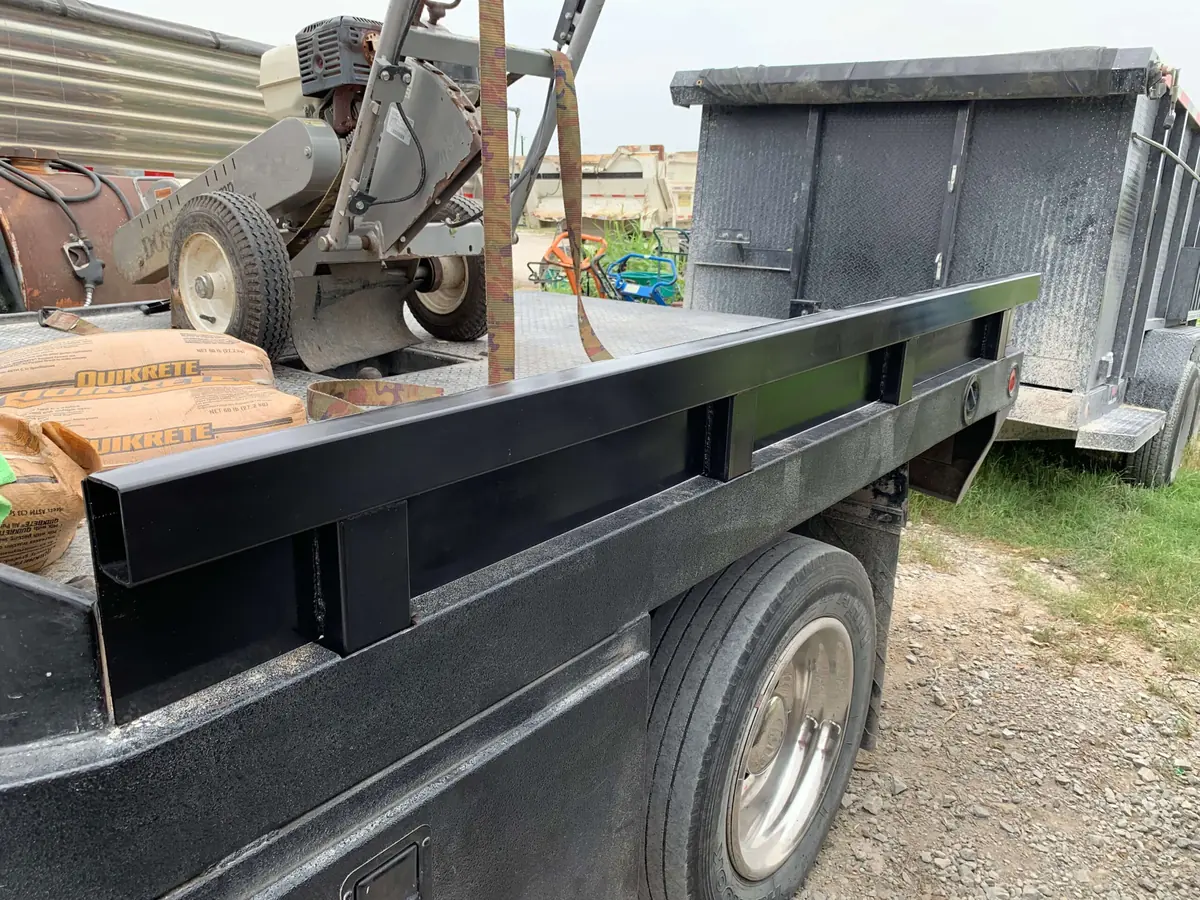 Custom steel side rails on a truck — fabricated and finished on-site by Marson Welding